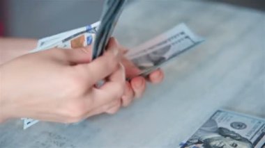 Businesswoman Hands Count Dollar Bills On Table In Office. Business And Finance Success Concept. Close Up