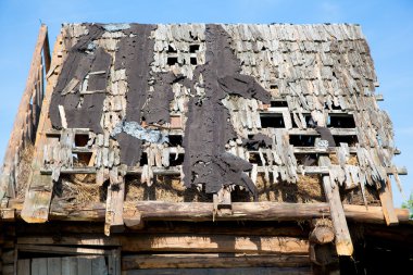 Dilapidated wooden leaky roof clipart