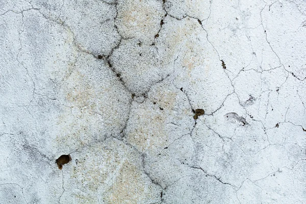 Pared gris abstracta en las grietas con manchas amarillas. Contexto . — Foto de Stock