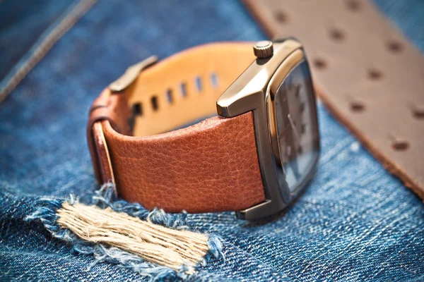 Watches and jeans — Stock Photo, Image