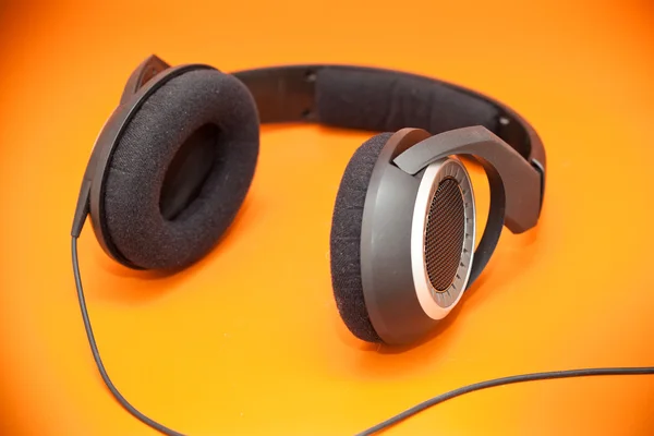 Headphones on an orange background — Stock Photo, Image