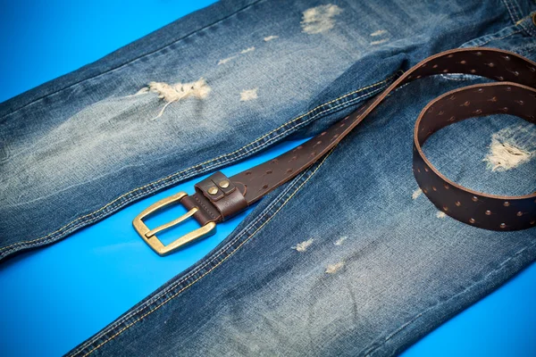 Blue jeans and leather belt with gold buckle — Stock Photo, Image