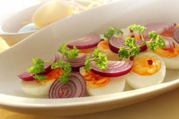 Boiled eggs with onion and herbs — Stock Photo, Image
