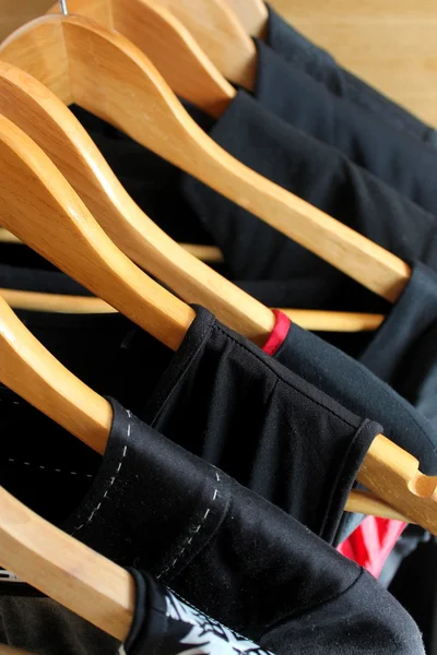 Collection of women's clothes hanging on a rack — Stock Photo, Image