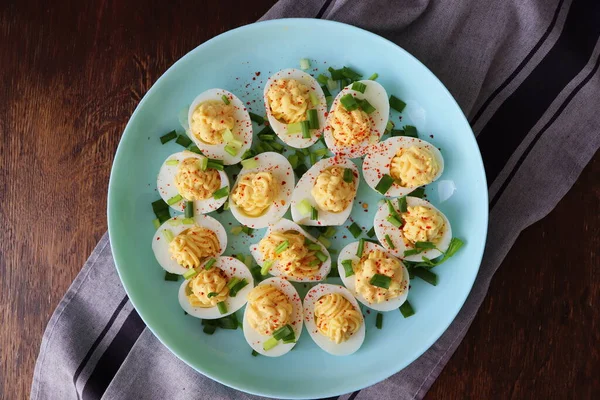 Deviled Eggs Sprinkled Paprika Chopped Green Onion Green Plate Woodene — Stock Photo, Image