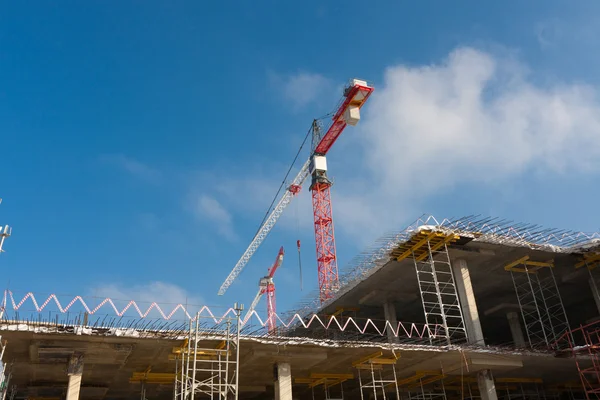 construction red crane against the blue sky