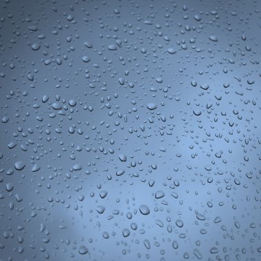 bir pencere camı üzerinde yağmur damlaları