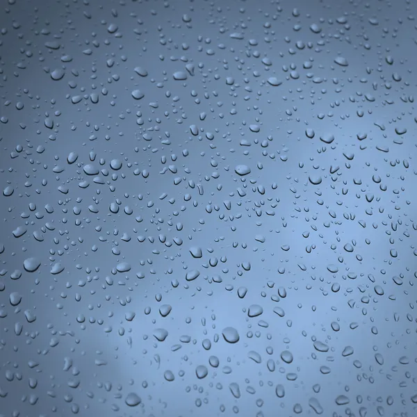 Gotas de lluvia en un cristal de ventana — Foto de Stock