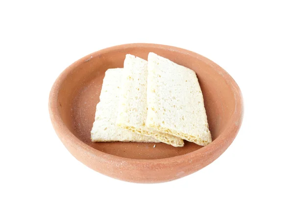 Crisp bread from corn grits in bowl of clay isolated on white background — Stock Photo, Image