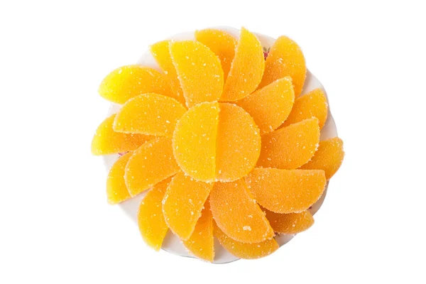 Pedaços de marmelada espalhados na forma de uma flor isolada sobre branco — Fotografia de Stock