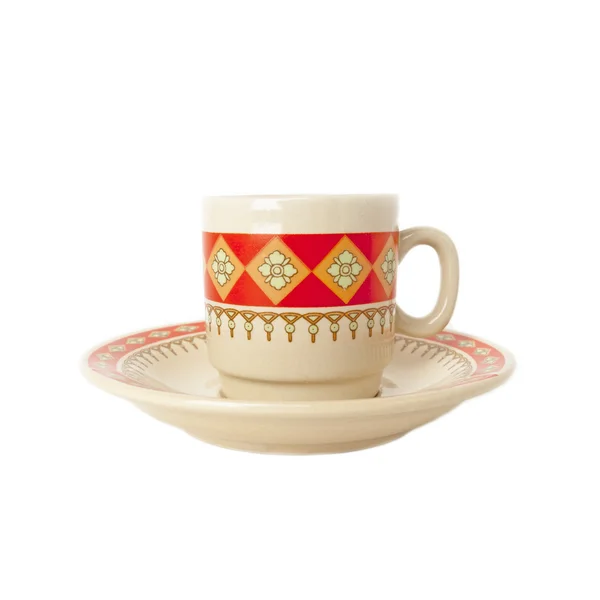 Coffee cup and saucer from clay with ethnic pattern isolated over white — Stock Photo, Image