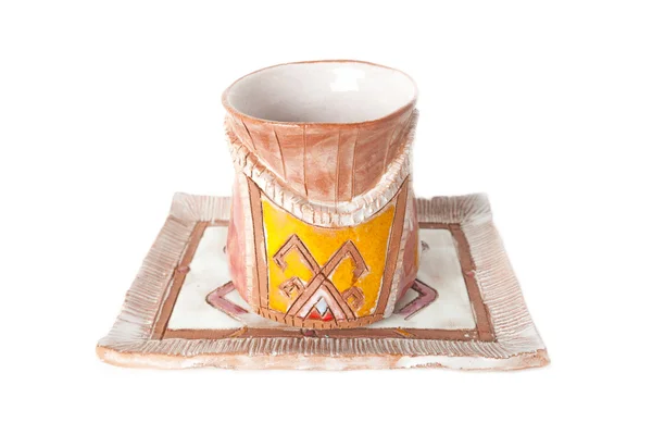 Cups and saucer for wine from clay with an ethnic ornament isolated over white — Stock Photo, Image