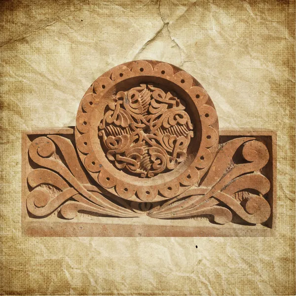 Medieval Armenian ornament on cross stone over paper background
