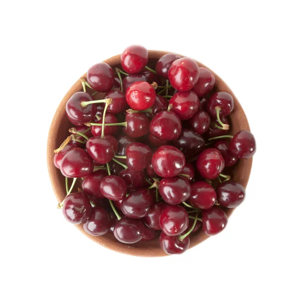 Red cherries in clay bowl isolated on white background — Stock Photo, Image