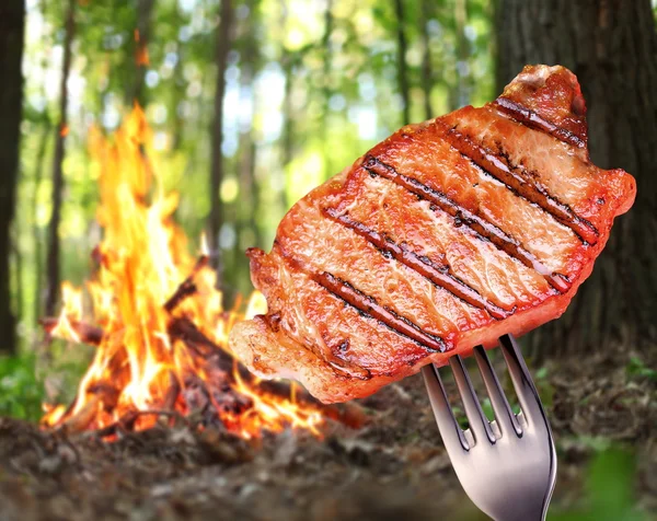 Steak on a fork. — Stock Photo, Image