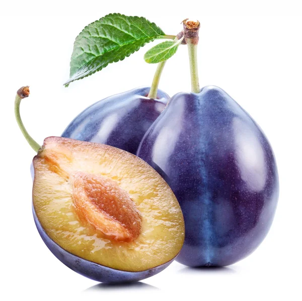 Plums with a slice and leaf Stock Picture