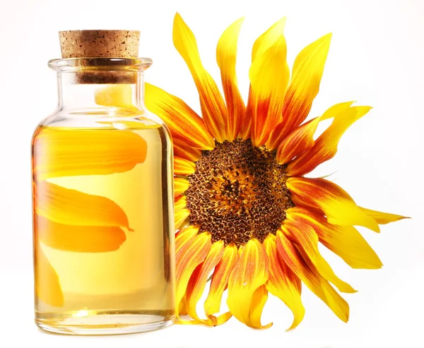 Cooking oil in glass bottle with sunflower on a white background — Stock Photo, Image