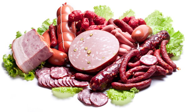 Meat and sausages on lettuce leaves.