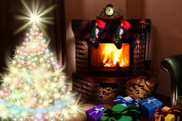 Christmas gifts by the fireplace. — Stock Photo, Image