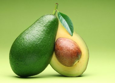 Avocado isolated on a green.