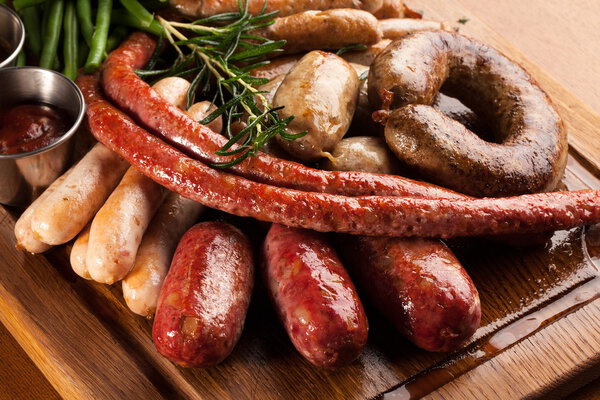 Assortment of grilled sausages.