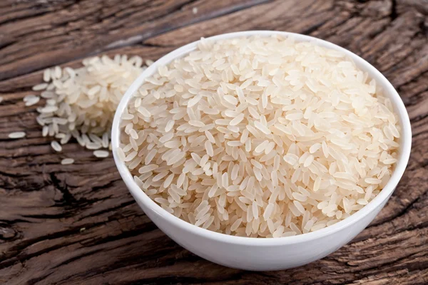 Uncooked rice in a bowl — Stock Photo, Image