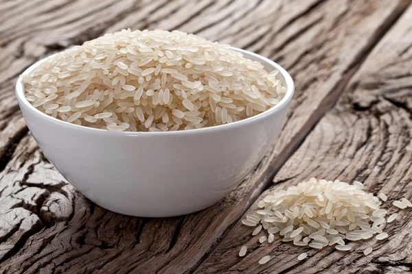 Uncooked rice in a bowl — Stock Photo, Image