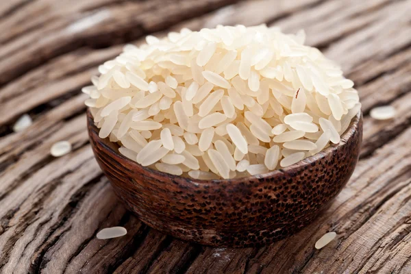 Uncooked rice in a bowl — Stock Photo, Image