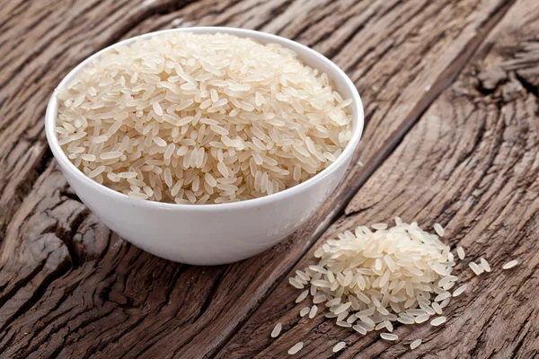 Uncooked rice in a bowl — Stock Photo, Image