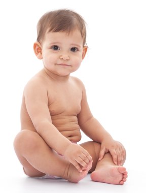 Funny baby sits on the floor. clipart