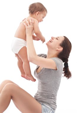 Happy baby plays with mother.