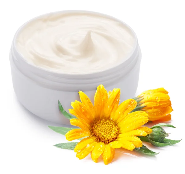 Jar of cream and calendula flower. — Stock Photo, Image