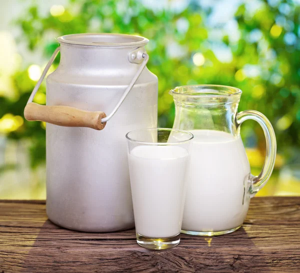 Milk in various dishes. — Stock Photo, Image