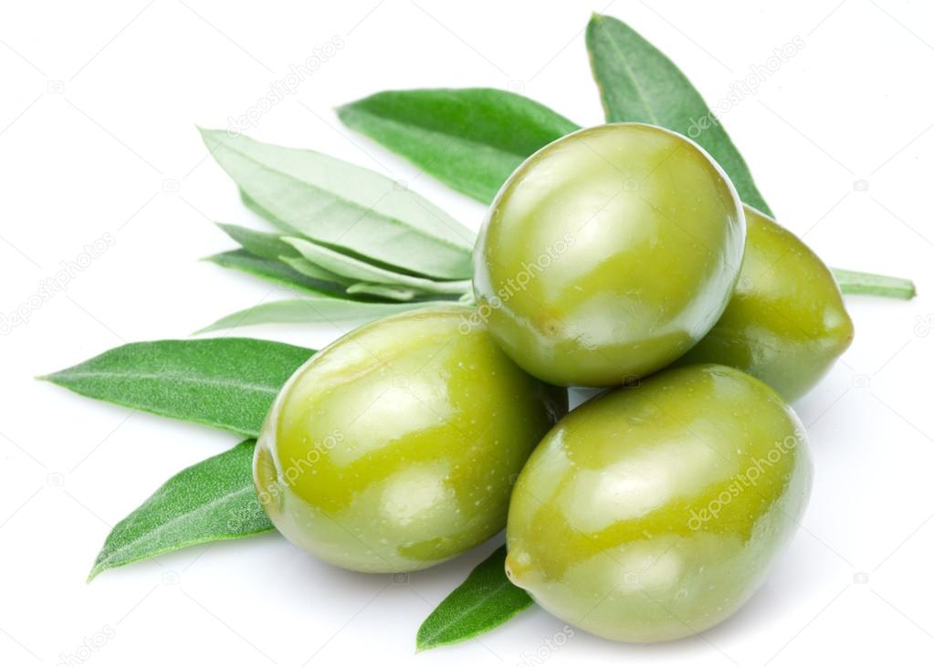 Green olives with leaves.