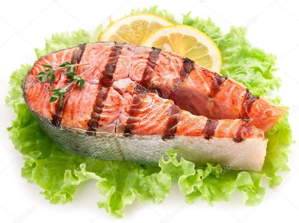 Grilled salmon and with lemon slices.