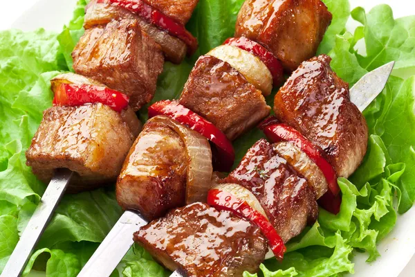 Grilled kebab (shashlik) on spits. — Stock Photo, Image