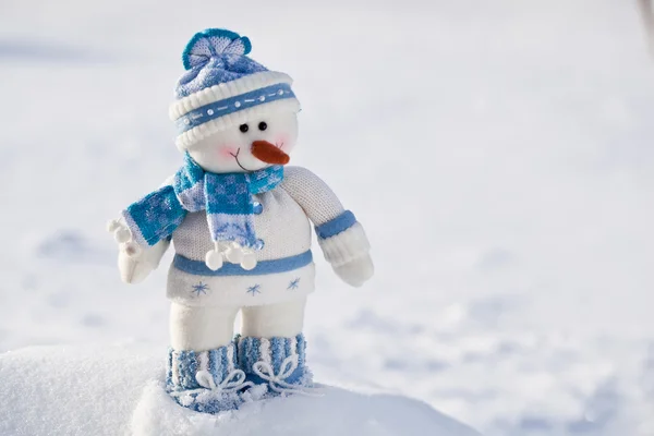Little snowman with carrot nose in the snow. — Stock Photo, Image