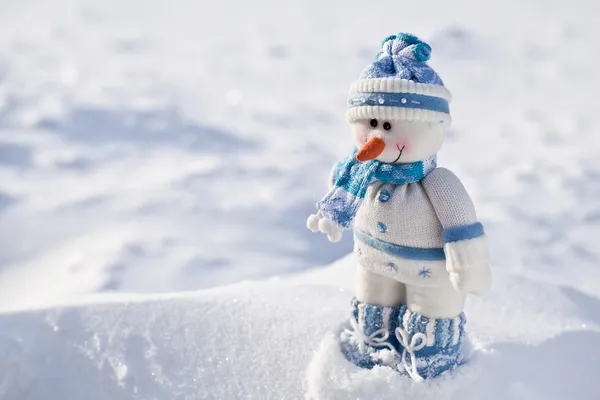 Little snowman with carrot nose in the snow. — Stock Photo, Image