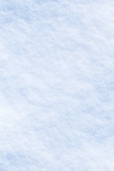 Niebieskim tle śniegu musujące. — Zdjęcie stockowe