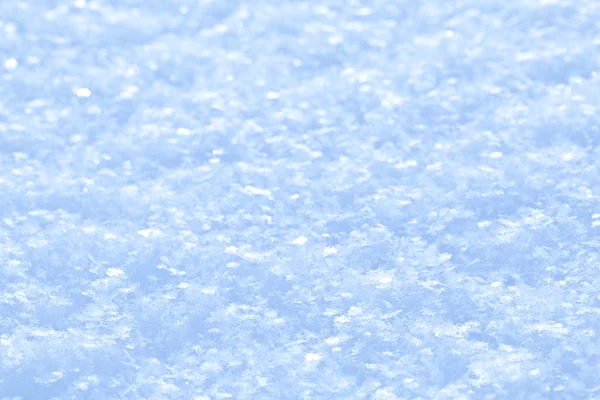 Blå gnistrande snö bakgrund. — Stockfoto