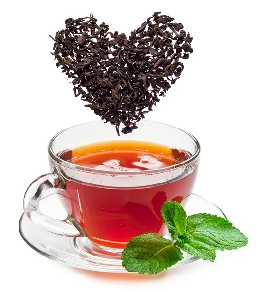 Cup of tea and tea leaves. — Stock Photo, Image