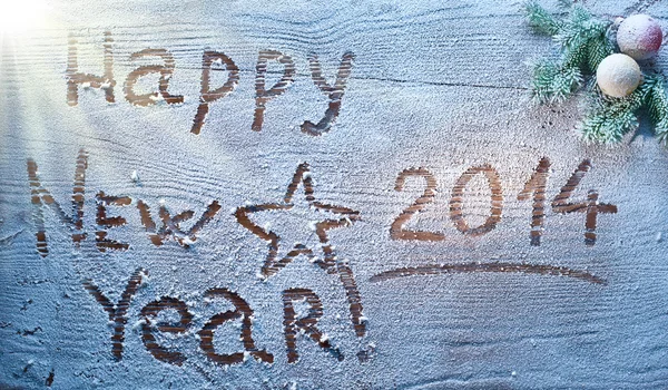 New Year 2014 on snow-covered wooden desk. — Stock Photo, Image