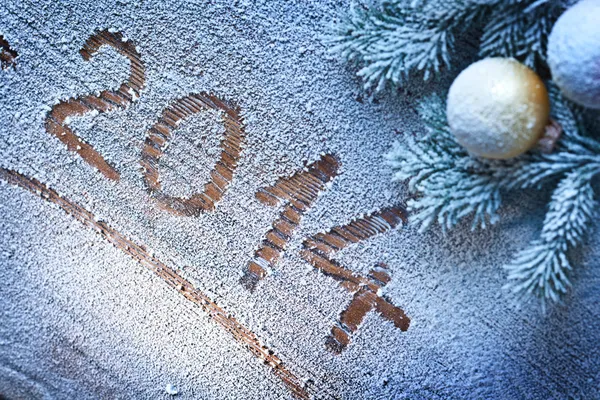 New Year 2014 on snow-covered wooden desk. — Stock Photo, Image