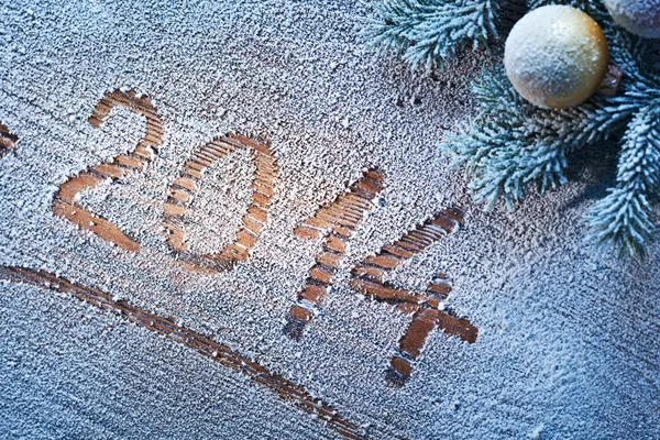 New Year 2014 on snow-covered wooden desk. — Stock Photo, Image