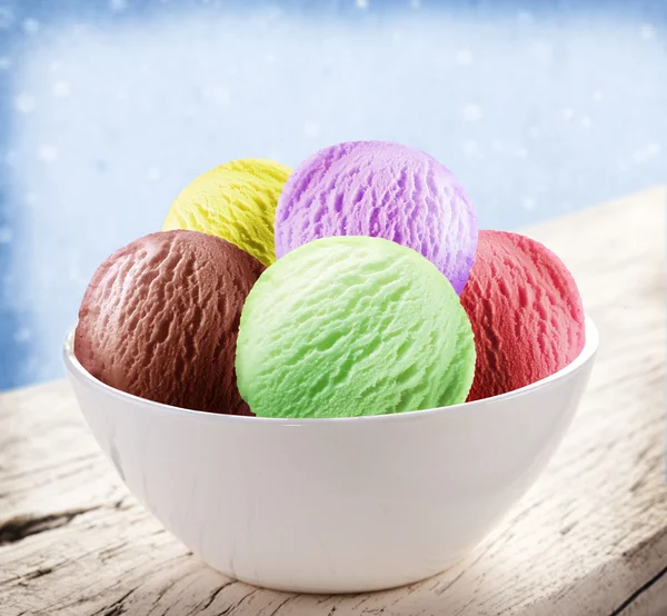 Colorful ice-cream scoops in white cones. — Stock Photo, Image