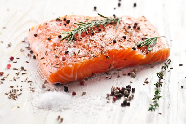 Salmon filet on a wooden carving board. — Stock Photo, Image