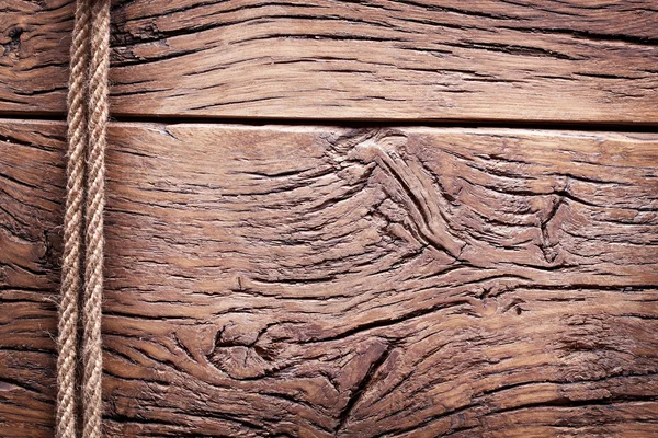 Corda sobre o fundo de madeira velho . — Fotografia de Stock