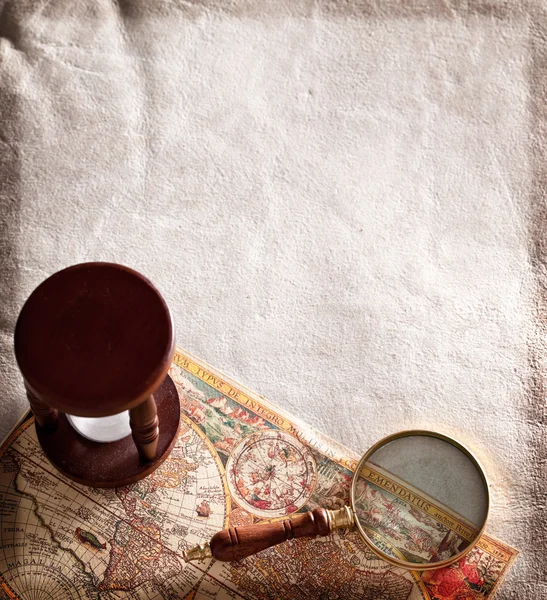 Hourglass with a magnifying glass. — Stock Photo, Image