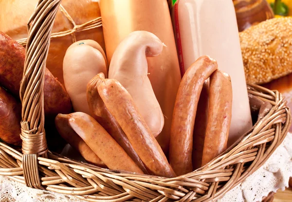 Variety of sausage products in the basket. — Stock Photo, Image