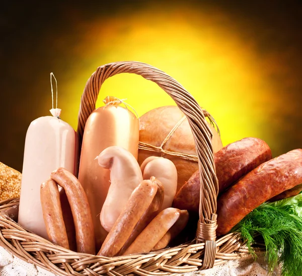 Variety of sausage products in basket. — Stock Photo, Image